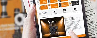 Hand with tablet and magazine